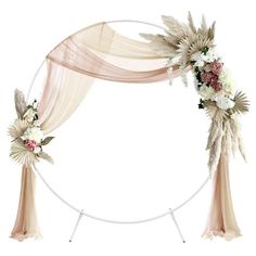 a wedding arch decorated with flowers and greenery