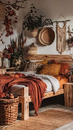 a bed sitting in a bedroom next to plants and wicker baskets on the wall