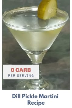 a martini with a lemon wedge in it and the words o carb per serving