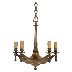 an antique chandelier with five candles hanging from it's center and two arms