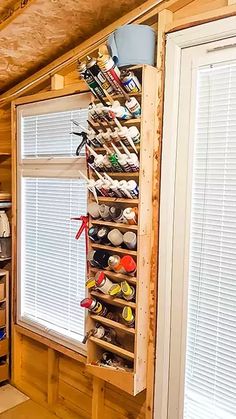 a kitchen with wooden cabinets and shelves filled with items