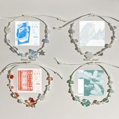 four bracelets with different designs on them and some cards attached to the clasps