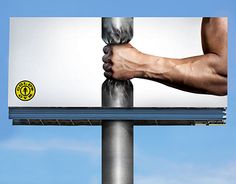 a billboard with the image of a man's hand on top of his leg