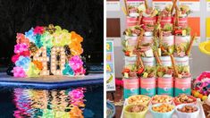 an assortment of food and drinks on display next to a table with balloons in the shape of letters