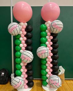 some balloons are arranged in the shape of volleyballs and balls on top of each other