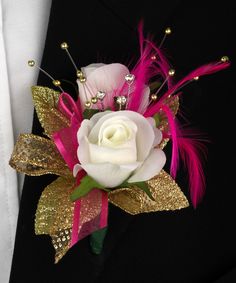 a boutonniere decorated with pink feathers and white rose on a black background