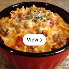 a close up of a bowl of food on a table with the words view above it