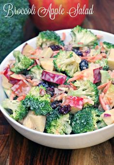 broccoli apple salad in a white bowl on a wooden table