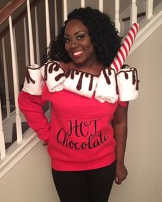 a woman in a hot chocolate sweater standing on the stairs