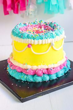 a birthday cake with sprinkles and frosting