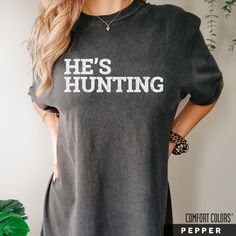 He's Hunting Sweatshirt, Hunting Season Sweater, Abandoned Hunting Wives Social Club, Duck Deer Season, Hunters Wife Shirt, Gift for Hunters T  S H I R T . I N F O The Unisex Garment-Dyed Heavyweight T-Shirt | Comfort Colors 1717 is the go-to choice for those who appreciate a structured-fit shirt, made from a thick but breathable material. The 100% cotton fabric is super soft and ensures comfy wear whatever the occasion. A favorite among many customers! I've included a sizing chart in the images of this listing to help answer any questions you have about dimensions.  100% ring-spun cotton Fabric weight: 6.1 oz/yd² (206.8 g/m²) Yarn diameter: 20 singles Garment-dyed, pre-shrunk fabric Relaxed fit 7/8″ double-needle topstitched collar Twill-taped neck and shoulders for extra durability Doubl Hunters Wife, Deer Season, Comfy Wear, Gifts For Hunters, Hunting Season, Womens Tank Tops, Social Club, Sizing Chart, Womens Clothing Tops