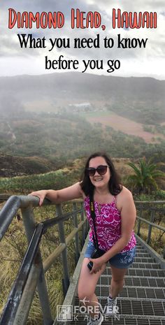 a woman standing on top of a metal handrail with the words diamond head, hawaii what you need to know before you go