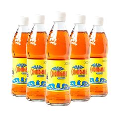 six bottles of orange juice on a white background