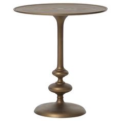 an antique brass table with two pedestals on each side and a round glass top