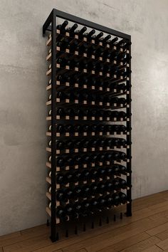 a wine rack with many bottles in it on the wall next to a wooden floor