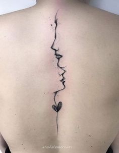 the back of a woman's neck with two faces and a flower