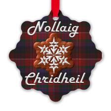 a christmas ornament with the words nollaig and an image of a snowflake