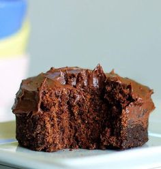 a chocolate cupcake cut in half on a plate