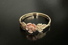 Vintage ring.  10K Gold/Rose Gold.  Lady's Black Hills.  Dainty floral design with single rose flanked by leaves.  Gemstone: None.  Marks are 10K and symbols of the maker.  Good condition.  Size 8 but can be sized up or down. Floral Promise Rings, Ring Inspo, Single Rose, Floral Ring, Rose Ring, Black Hills, Gold Floral, Jewelry Inspo, Vintage Ring