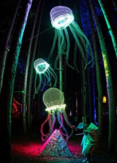 an image of jellyfishs in the forest at night time with text that reads, i