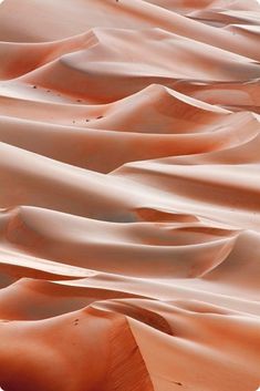 sand dunes in the desert with no one on them or people walking through it,