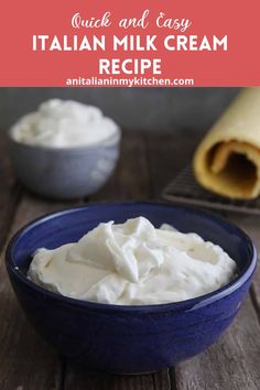 a blue bowl filled with whipped cream next to a rolled up cheesecloth on a wooden table