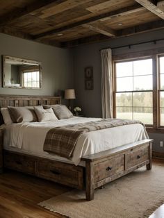 a bed sitting in a bedroom next to a window with wooden beams on the ceiling