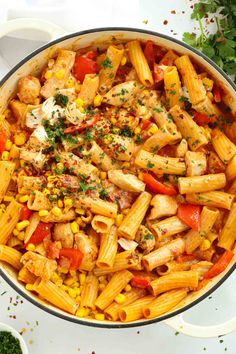 pasta with chicken and vegetables in a skillet