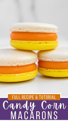 three candy corn macarons stacked on top of each other with text overlay