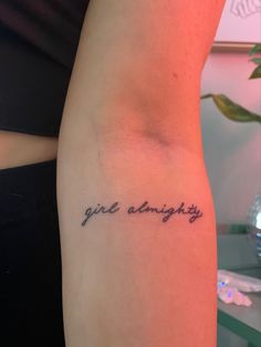 a woman with a tattoo on her arm that says, girl angry