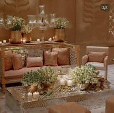 a living room filled with furniture and candles