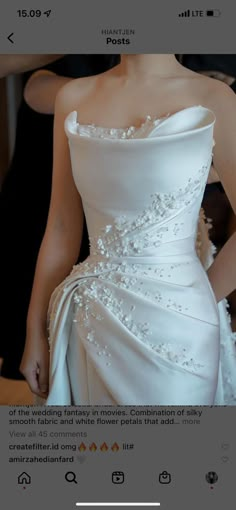 the back of a wedding dress with beading on it