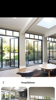 an image of a living room with large windows