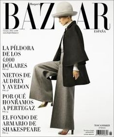 a woman in a hat and coat on the cover of harper magazine, wearing an overcoat