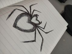 a drawing of a spider on top of a piece of paper with the word love written in it