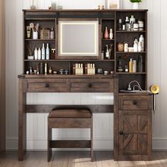 a wooden desk topped with a mirror next to a shelf filled with lots of bottles