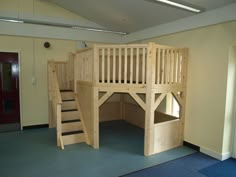 there is a loft bed with stairs in the room