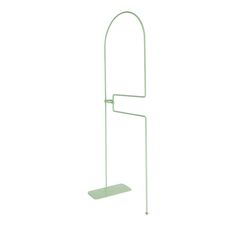 a green metal stand with two hooks on it