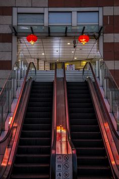 an escalator with two red lights above it