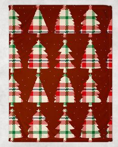 a red and green christmas tree pattern on a brown background with white polka dotes