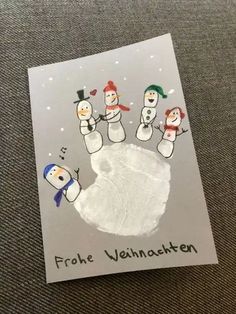 a handprint with three snowmen on it that says frohe vehnatten