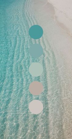 the water is crystal blue and has five circles in it