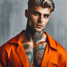 a man with tattoos on his chest wearing an orange shirt and looking at the camera