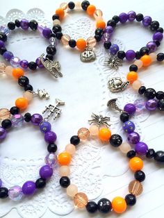 the bracelets are decorated with beads and charms