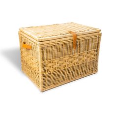 an empty wicker basket with leather handles on a white background for use as a storage container