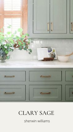 a kitchen with green cabinets and white counter tops, along with the words clayy sage written on it