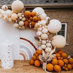 an outdoor display with balloons and decorations