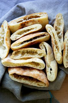 some bread is cut in half on a cloth