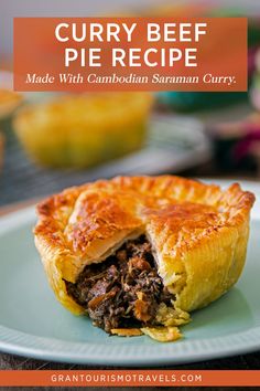 a close up of a pie on a plate with the words curry beef pie recipe