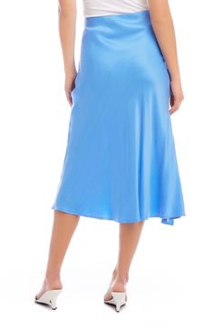 A vibrant solid hue emboldens this wrapped skirt tethered with a defining side tie. 33" length (size Small) True wrap style with side tie closure Unlined 53% cupro, 47% viscose Dry clean Made in the USA of imported fabric Blue Silk Relaxed Skirt, Blue Silk Relaxed Skirt Bottoms, Blue Silk Lined Skirt, Blue Silk Lined Bottoms, Blue Flowy Lined Wrap Skirt, Blue Asymmetrical Flowy Wrap Skirt, Chic Fitted Blue Wrap Skirt, Elegant Blue Asymmetrical Skirt, Knee-length Solid Wrap Skirt